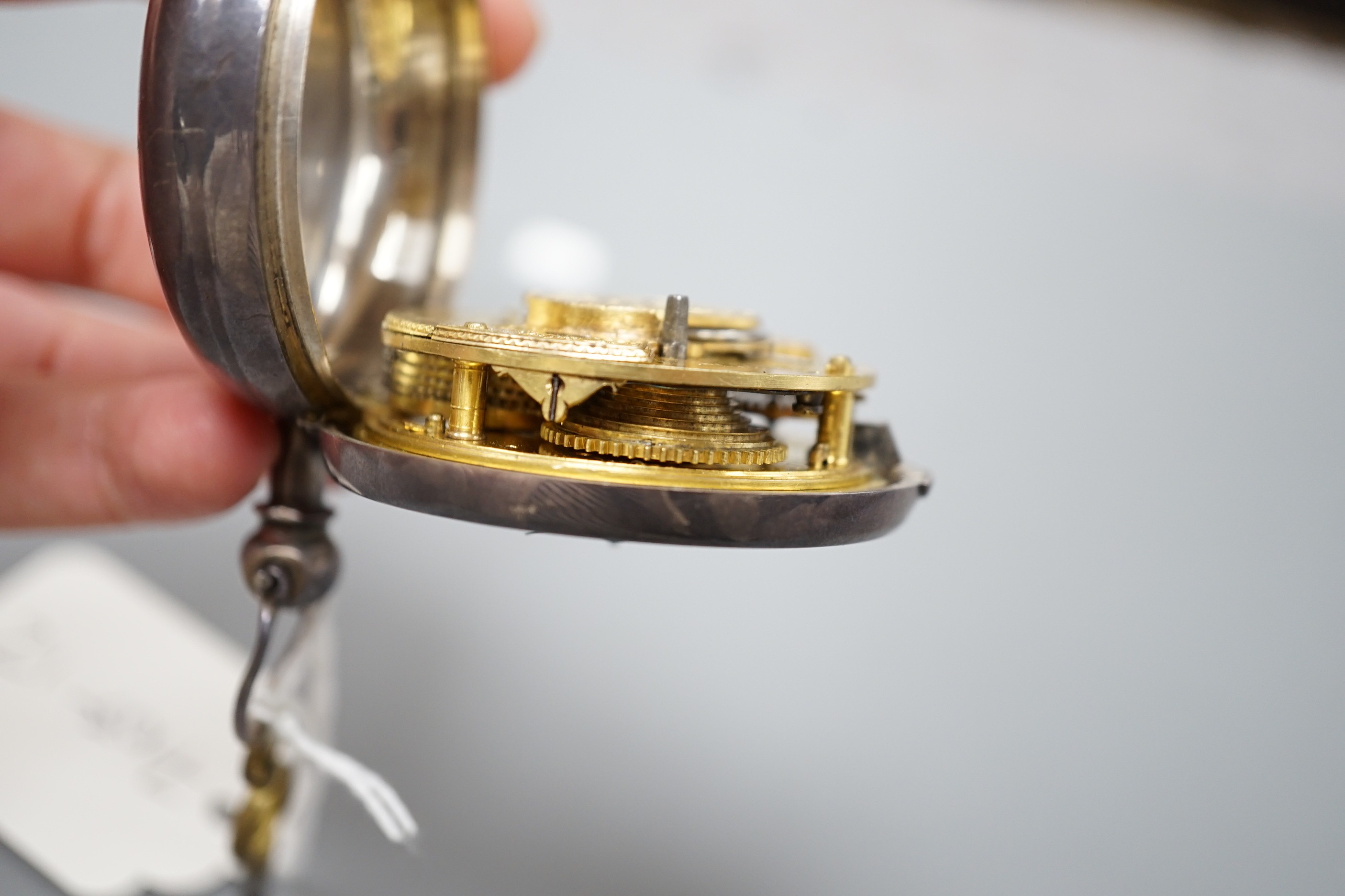 A George IV silver keywind verge pocket watch, by Tanner of Hailsham, with Arabic dial and engraved name verso, case diameter 51mm, with key, (missing outer case?).